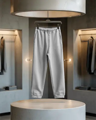 Modern Showroom Sweatpants Mockup Hanging Display With Soft Lighting On Round Stage