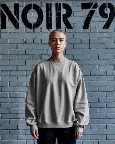 Urban Sweatshirt Mockup Female Model In Grey Crewneck Standing Against Painted Brick Wall With Noir Graffiti Edgy Street Style