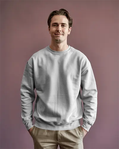 Neutral Studio Sweatshirt Mockup Male Model Smiling Hands In Pockets Against Mauve Wall Soft Lighting Casual And Clean Look