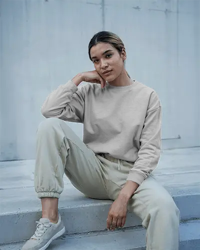 Urban Concrete Sweatshirt Mockup Female Model Seated On Steps Soft Natural Lighting Casual Athleisure Look Contemporary Minimal Backdrop