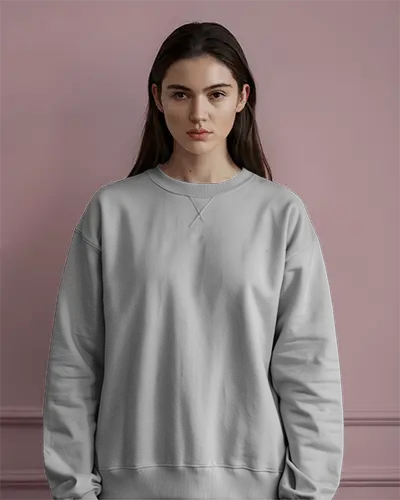 Minimal Studio Sweatshirt Mockup Female Model Standing Against Muted Pink Wall Soft Lighting Serene Expression Elegant And Clean Aesthetic