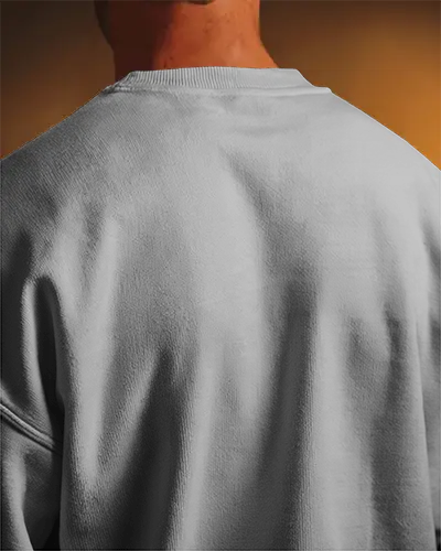 Dramatic Closeup Sweatshirt Mockup Back View Male Model Under Warm Spotlight Focus On Texture And Print Bold Light Shadow Contrast