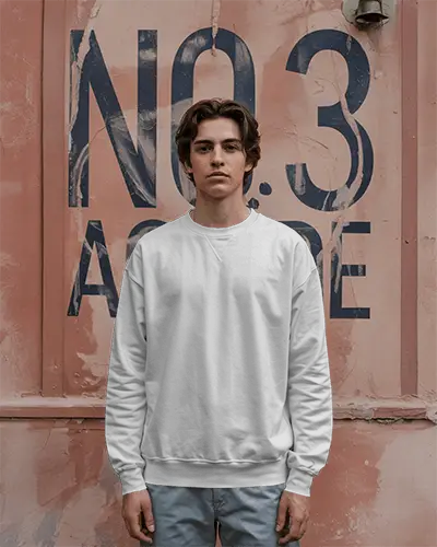 Urban Streetwear White Sweatshirt Mockup On Male Model Standing Against Urban Wall