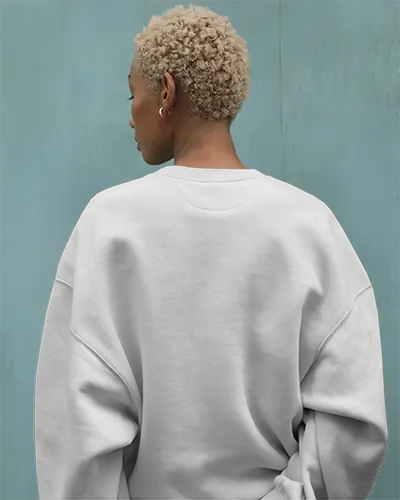 back-view-white-sweatshirt-mockup-black-female-model-short-curly-hair-blue-wall-background-custom-design-template