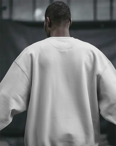 back-view-white-sweatshirt-mockup-male-model-in-urban-setting-moody-lighting-custom-design-template-for-pod