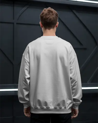 Urban Studio Back View Sweatshirt Mockup Male Model Against Dark Industrial Wall