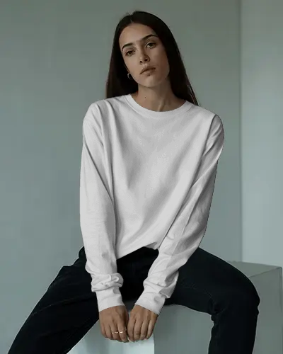 Chic Fashion Sweatshirt Mockup Woman In Long Sleeve Relaxed Pose On Modern Studio Block