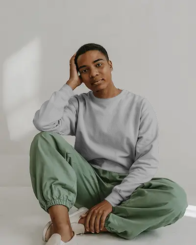 Relaxed Lifestyle Sweatshirt Mockup Male Model Sitting On Floor In Studio With Natural Light