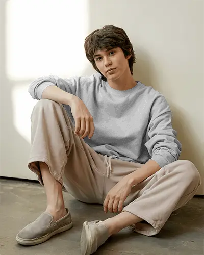 Relaxed Floor Pose Sweatshirt Mockup Male Model In Casual Style With Natural Light Setting
