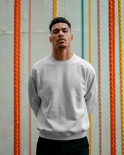 Urban Lifestyle Sweatshirt Mockup Male Model Standing In Front Of Colorful Hanging Ropes