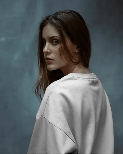 Minimalist Fashion Sweatshirt Mockup Woman Posing Back In Soft Light With Studio Wall Backdrop
