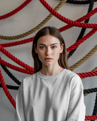 Bold Fashion Sweatshirt Mockup Female Model Posing With Vivid Red Yellow And Black Rope Display