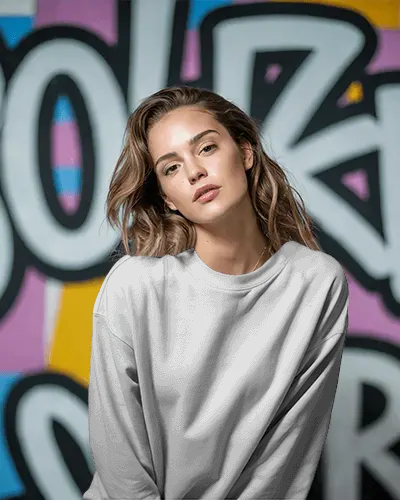 Urban Graffiti Sweatshirt Mockup Female Model In Relaxed Pose Against Colorful Street Art Wall