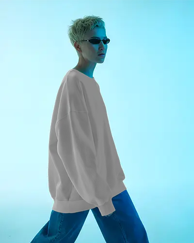 Lifestyle Sweatshirt Mockup Female Model In Blue Studio Wearing Sunglasses Streetwear Style