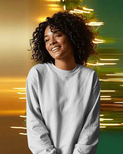 Sweatshirt Mockup Smiling Female Model In Warm Holiday Light Trails With Cozy Lifestyle Mood