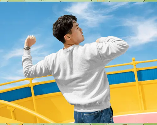 Outdoor Men Sweatshirt Mockup Back View Boy Raising Arms Under Blue Sky Playful Energy
