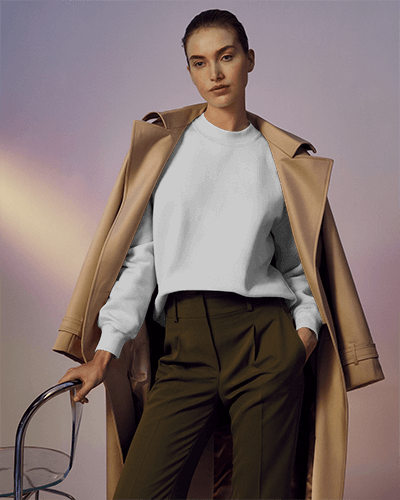 Sophisticated Editorial Sweatshirt Mockup Female Model In Trench Coat And High Fashion Pose