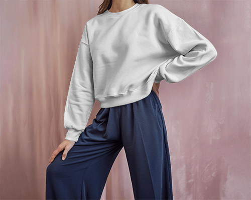 Pink Drape Sweatshirt Mockup Female Model In Loose Pants With Soft Lighting