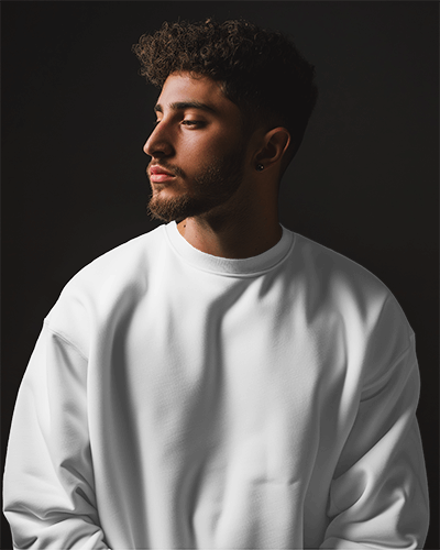 Man Wearing Sweatshirt Mockup In Dark Studio