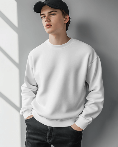 Male Model Wearing Sweatshirt Mockup Against Soft Light In Modern Setting