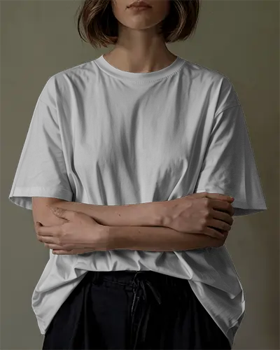 Clean And Elegant T Shirt Mockup Female Model With Neutral Expression In Subtle Light