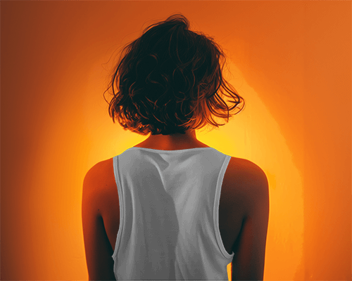 Back View Of A Model Wearing Tanktop Mockup With Cinematic Effect In Background