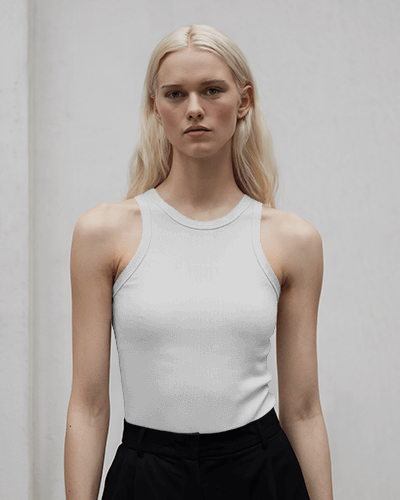 Trendy Art Inspired Tanktop Mockup Featuring Statue And Crown Motif On Dark Green Fabric