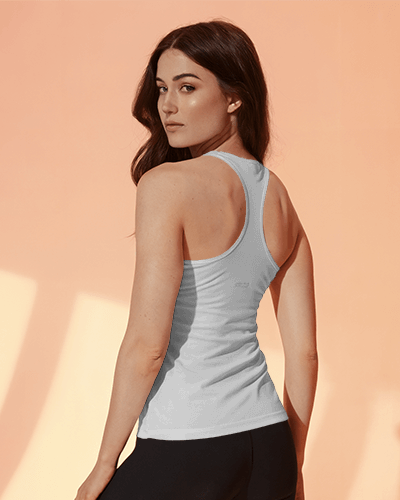 Woman In Lavender Tanktop Mockup Under Soft Peach Tones With Inspirational Slogan