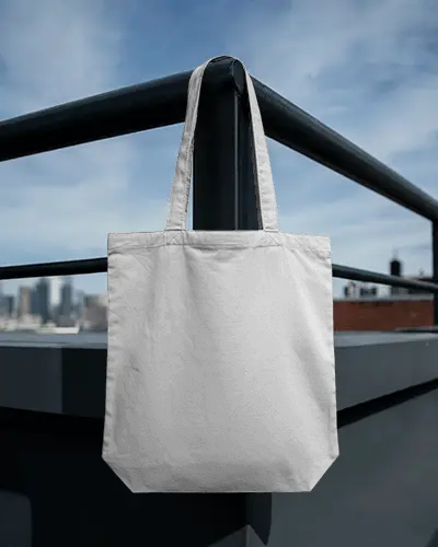 Rooftop Metal Railing Tote Bag Mockup Hanging Against Blue Sky Urban Cityscape Minimal Modern Style