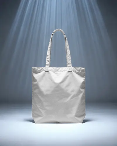 cinematic-tote-bag-mockup-standing-under-spotlight-beams-on-dark-blue-stage-floor-background