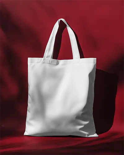 Tote Bag Mockup On Contrasting Red Backdrop With Cosmic Print Dream Typography Design