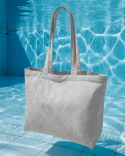 Floating Tote Bag Mockup Hovering Above Swimming Pool With Light Reflections