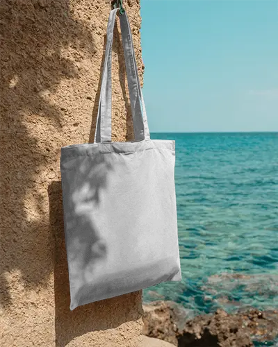 Beachside Summer Tote Bag Mockup On Rough Surface With Ocean View And Bright Natural Light 0307