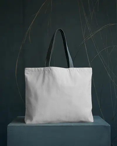 wide-tote-bag-mockup-on-blue-podium-with-minimal-gold-line-accents