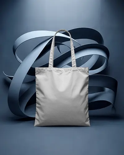 tote-bag-mockup-in-blue-studio-with-abstract-ribbon-sculpture-artistic-modern-display
