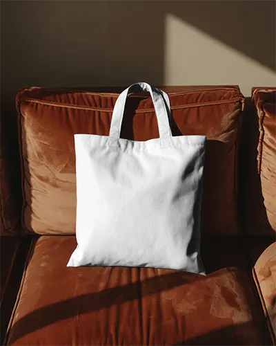 cozy-living-room-tote-bag-mockup-on-soft-velvet-couch-warm-sunlight-stylish-modern-home-decor