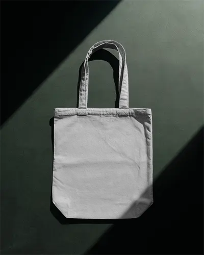 sleek-tote-bag-mockup-under-studio-spotlight-clean-dark-background-minimal-elegant-branding