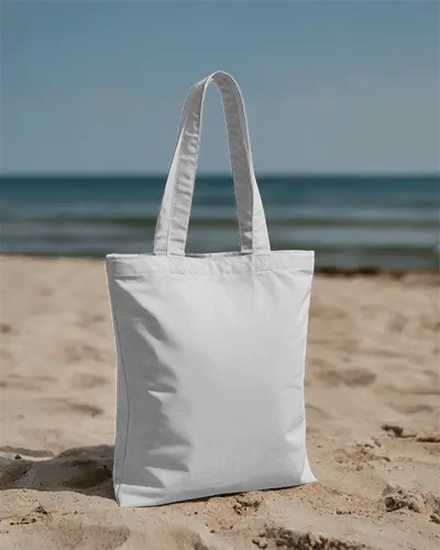 beach-vibes-tote-bag-mockup-on-sand-near-ocean-minimal-summer-style-eco-friendly-accessory