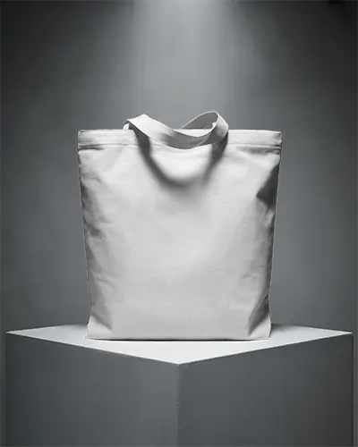 dramatic-monochrome-tote-bag-mockup-on-pedestal-with-spotlight-elegant-high-fashion-presentation