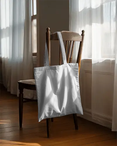 cozy-home-tote-bag-mockup-on-rustic-wooden-chair-sunlit-window-minimal-vintage-style-decor