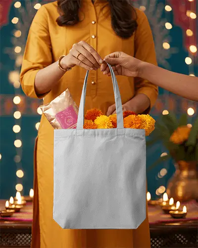 Reusable Tote Bag Mockup Held By Two Hands With Traditional Festival Theme Setting