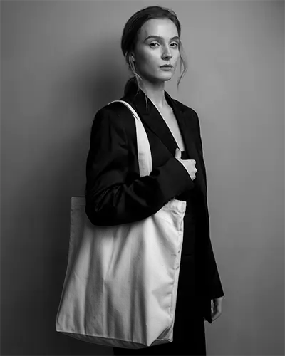 Stylish Minimalist Woman Showcasing Large Tote Bag Mockup For Fashion Accessories Brand Promotions