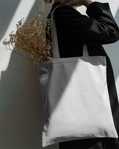 Eco Friendly Tote Bag Mockup Carrying Dried Flowers In Modern Minimalist Style Promo
