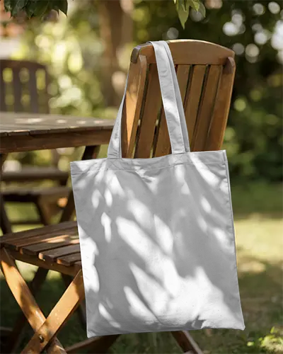 Eco Friendly Tote Bag Mockup With Long Handles Hanging On Wooden Outdoor Chair