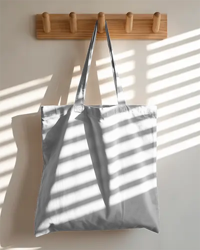 Eco Friendly Reusable Tote Bag Mockup With Natural Light And Wall Hooks Background