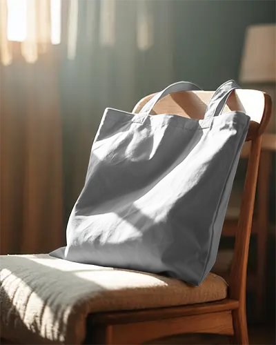 Stylish Canvas Tote Bag Mockup On Wooden Chair In Soft Natural Light Background