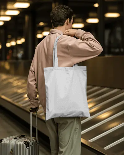 Airport Travel Tote Bag Mockup Man Standing By Luggage Carousel In Modern Terminal