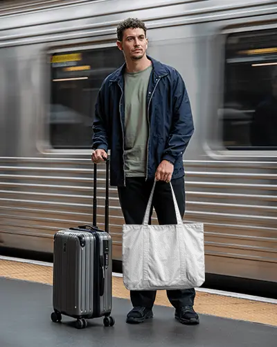 Commuter Travel Tote Bag Mockup Man Standing By Train With Suitcase On Platform