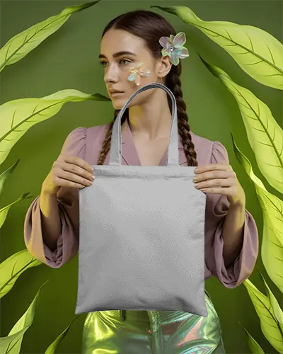 Ethereal Botanical Tote Bag Mockup Woman Holding Bag In Artistic Leaf Scene
