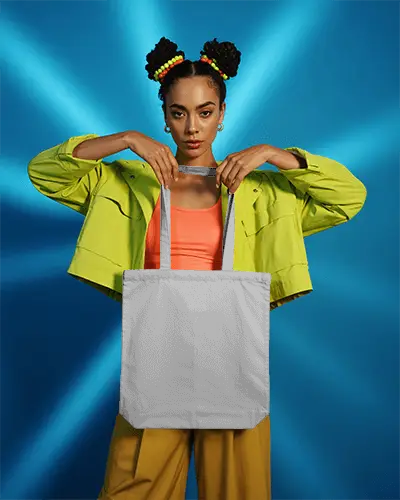 Vibrant Studio Tote Bag Mockup Woman Holding Bag Against Blue Radiant Backdrop